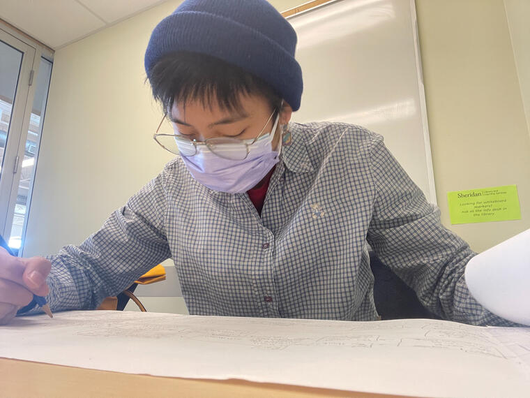 Working on the paper prototype of dialogue branching.